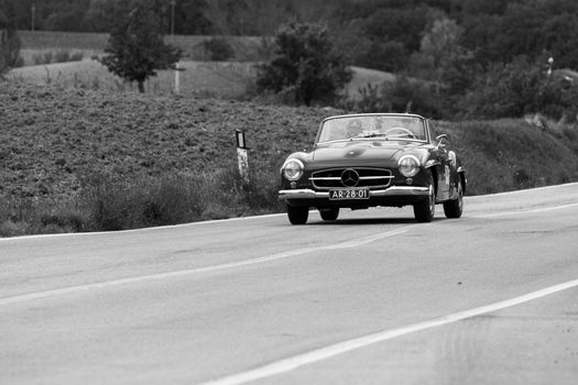 CAGLI , ITALY - OTT 24 - 2020 : MERCEDES-BENZ 190 SL 1955 on an old racing car in rally Mille Miglia 2020 the famous italian historical race (1927-1957