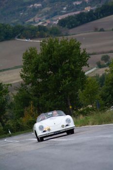 CAGLI , ITALY - OTT 24 - 2020 : PORSCHE 356 SPEEDSTER 1500 1955 on an old racing car in rally Mille Miglia 2020 the famous italian historical race (1927-1957)