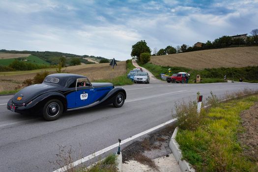 CAGLI , ITALY - OTT 24 - 2020 : LANCIA ASTURA 1938 on an old racing car in rally Mille Miglia 2020 the famous italian historical race (1927-1957