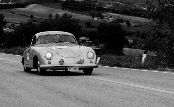 CAGLI , ITALY - OTT 24 - 2020 : PORSCHE 356 1500 SUPER COUPÉ 1953 on an old racing car in rally Mille Miglia 2020 the famous italian historical race (1927-1957)