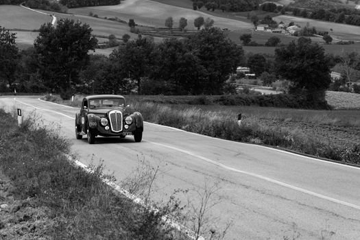 CAGLI , ITALY - OTT 24 - 2020 : LANCIA ASTURA 1938 on an old racing car in rally Mille Miglia 2020 the famous italian historical race (1927-1957