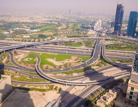 Amazing view of the junction roads from above in Dubai. Traffic on the highway. Background wallpaper photo.