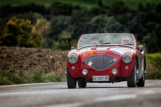 CAGLI , ITALY - OTT 24 - 2020 : AUSTIN HEALEY 100/4 BN2 1956 on an old racing car in rally Mille Miglia 2020 the famous italian historical race (1927-1957)