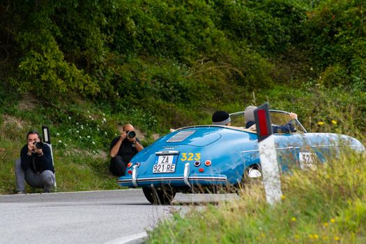 CAGLI , ITALY - OTT 24 - 2020 : PORSCHE 356 1500 SPEEDSTER 1955 on an old racing car in rally Mille Miglia 2020 the famous italian historical race (1927-1957