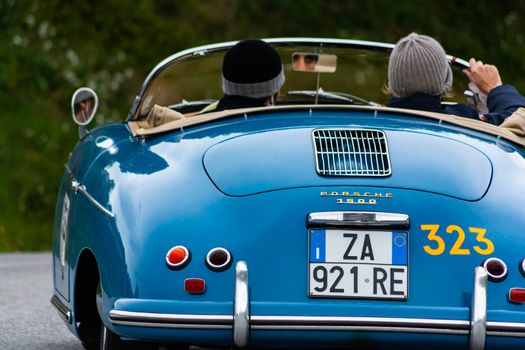 CAGLI , ITALY - OTT 24 - 2020 : PORSCHE 356 1500 SPEEDSTER 1955 on an old racing car in rally Mille Miglia 2020 the famous italian historical race (1927-1957