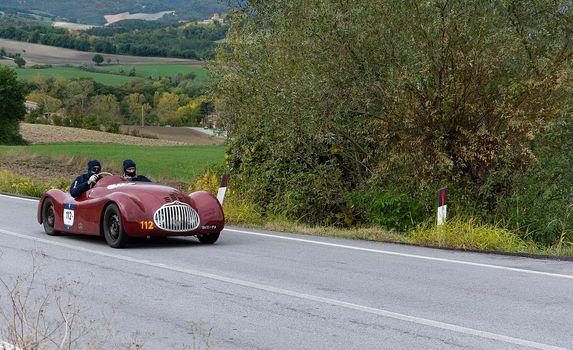 CAGLI , ITALY - OTT 24 - 2020 : FIAT-LANCIA APRILIA BARCHETTA FAINA 1939 on an old racing car in rally Mille Miglia 2020 the famous italian historical race (1927-1957