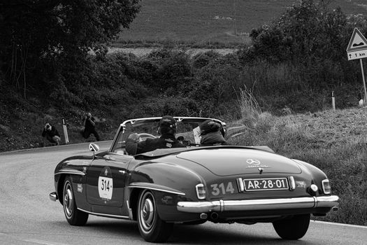 CAGLI , ITALY - OTT 24 - 2020 : MERCEDES-BENZ 190 SL 1955 on an old racing car in rally Mille Miglia 2020 the famous italian historical race (1927-1957