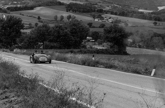 CAGLI , ITALY - OTT 24 - 2020 : FIAT-LANCIA APRILIA BARCHETTA FAINA 1939 on an old racing car in rally Mille Miglia 2020 the famous italian historical race (1927-1957