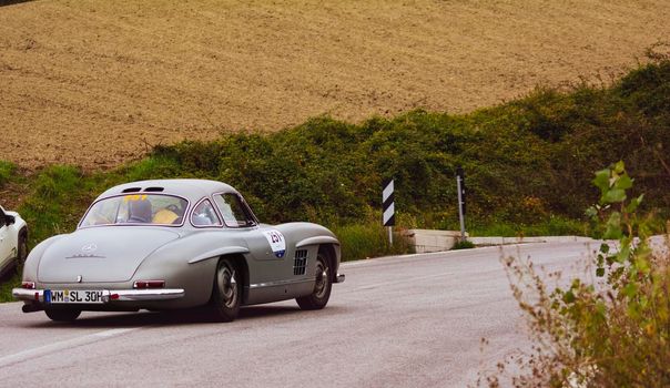 CAGLI , ITALY - OTT 24 - 2020 : MERCEDES-BENZ 300 SL W 198 1954 an old racing car in rally Mille Miglia 2020 the famous italian historical race (1927-1957)