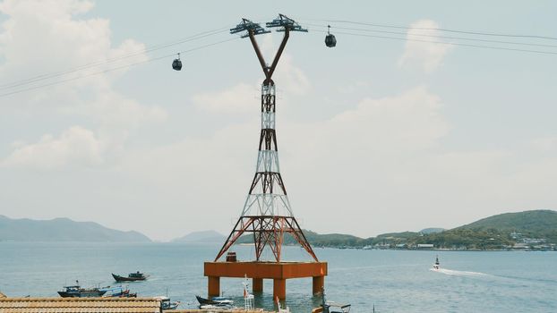 Cable car to Vinpearl amusement park in the morning sunshine to attract tourists to the weekend relaxing in Nha Trang, Vietnam.