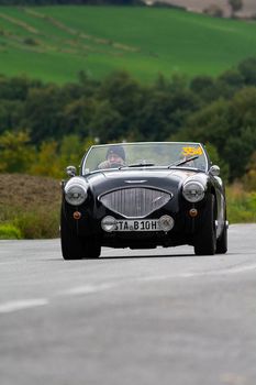 CAGLI , ITALY - OTT 24 - 2020 : AUSTIN HEALEY 100/4 BN2 1956 an old racing car in rally Mille Miglia 2020 the famous italian historical race