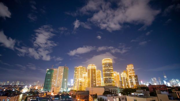 Time lapse view of Makati skyscrapers in Manila city. Skyline at night, Philippines