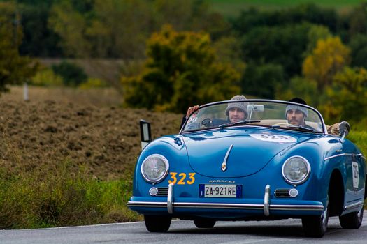 CAGLI , ITALY - OTT 24 - 2020 : PORSCHE 356 1500 SPEEDSTER 1955 on an old racing car in rally Mille Miglia 2020 the famous italian historical race (1927-1957