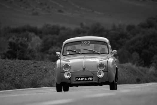 CAGLI , ITALY - OTT 24 - 2020 : RENAULT DAUPHINE 1957 on an old racing car in rally Mille Miglia 2020 the famous italian historical race (1927-1957