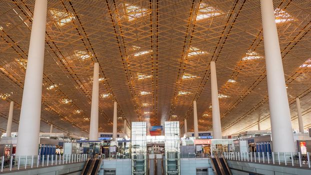 China Airport in Beijing. Terminal airport with passengers waiting for departure.