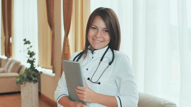 Portrait of a young female doctor in a good mood