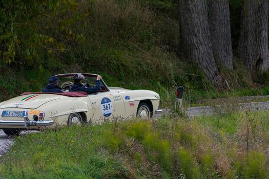 CAGLI , ITALY - OTT 24 - 2020 : MERCEDES-BENZ 190 SL 1956 on an old racing car in rally Mille Miglia 2020 the famous italian historical race (1927-1957