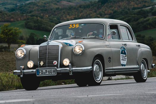 CAGLI , ITALY - OTT 24 - 2020 : MERCEDES-BENZ 220 A 1955 an old racing car in rally Mille Miglia 2020 the famous italian historical race (1927-1957)