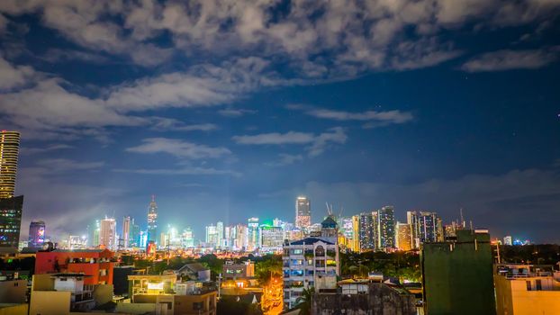 Time lapse view of Makati skyscrapers in Manila city. Skyline at night, Philippines