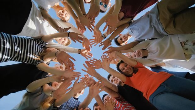 School class collection. The pupils wave their hands and run. ollege Students Teamwork Stacking Hand Concept. Nineteen friends