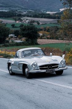 CAGLI , ITALY - OTT 24 - 2020 : MERCEDES-BENZ 300 SL W 198 1955 an old racing car in rally Mille Miglia 2020 the famous italian historical race (1927-1957)