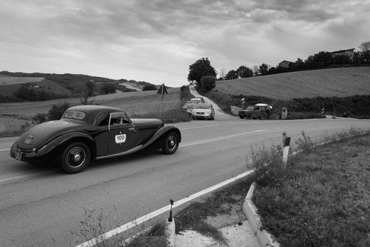 CAGLI , ITALY - OTT 24 - 2020 : LANCIA ASTURA 1938 on an old racing car in rally Mille Miglia 2020 the famous italian historical race (1927-1957