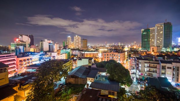 Time lapse view of Makati skyscrapers in Manila city. Skyline at night, Philippines