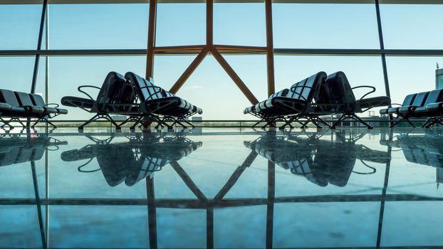 Empty empty airport terminal with passenger seats.