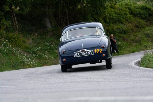 CAGLI , ITALY - OTT 24 - 2020 : SIMCA 9 ARONDE COUPÉ 1952 on an old racing car in rally Mille Miglia 2020 the famous italian historical race (1927-1957)