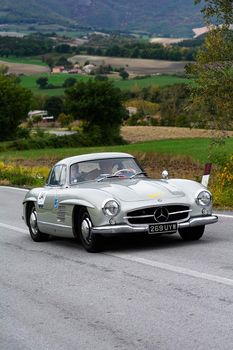 CAGLI , ITALY - OTT 24 - 2020 : MERCEDES-BENZ 300 SL W 198 1955 an old racing car in rally Mille Miglia 2020 the famous italian historical race (1927-1957)