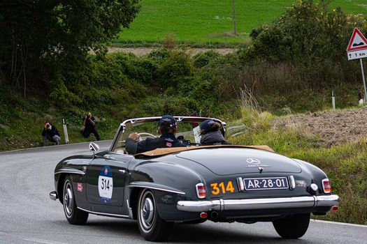 CAGLI , ITALY - OTT 24 - 2020 : MERCEDES-BENZ 190 SL 1955 on an old racing car in rally Mille Miglia 2020 the famous italian historical race (1927-1957