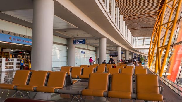 China Airport in Beijing. Terminal airport with passengers waiting for departure.