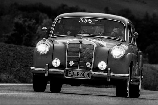 CAGLI , ITALY - OTT 24 - 2020 : MERCEDES-BENZ 220 A 1955 an old racing car in rally Mille Miglia 2020 the famous italian historical race (1927-1957)