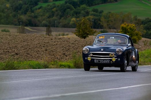 CAGLI , ITALY - OTT 24 - 2020 : SIMCA 9 ARONDE COUPÉ 1952 on an old racing car in rally Mille Miglia 2020 the famous italian historical race (1927-1957)