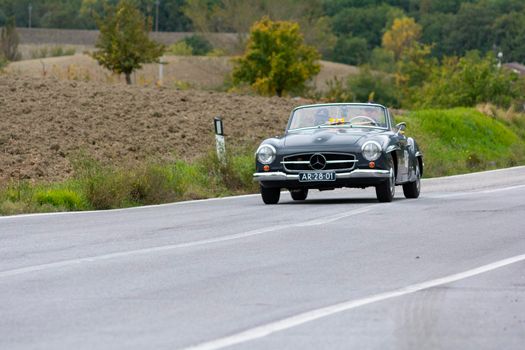 CAGLI , ITALY - OTT 24 - 2020 : MERCEDES-BENZ 190 SL 1955 on an old racing car in rally Mille Miglia 2020 the famous italian historical race (1927-1957