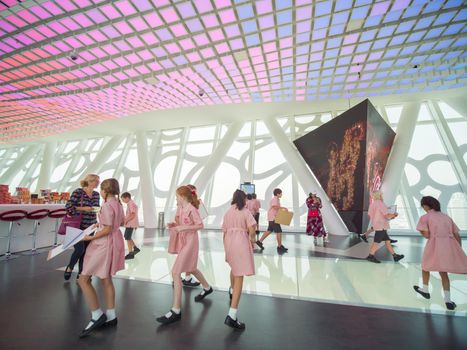 The interior of the building with visitors to Dubai Frame.