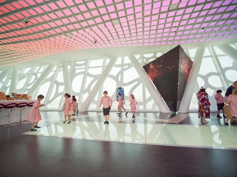 The interior of the building with visitors to Dubai Frame.