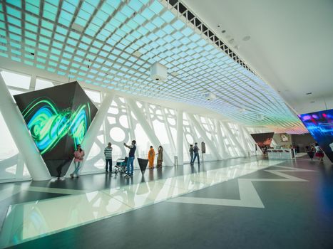 The interior of the building with visitors to Dubai Frame.