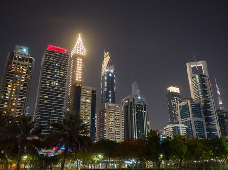 The streets of the night city and skyscrapers of Dubai. Timelapse