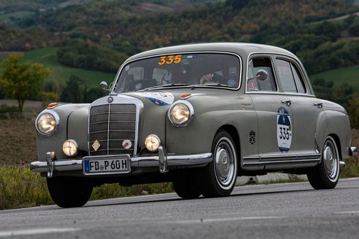 CAGLI , ITALY - OTT 24 - 2020 : MERCEDES-BENZ 220 A 1955 an old racing car in rally Mille Miglia 2020 the famous italian historical race (1927-1957)