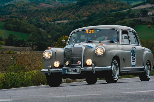 CAGLI , ITALY - OTT 24 - 2020 : MERCEDES-BENZ 220 A 1955 an old racing car in rally Mille Miglia 2020 the famous italian historical race (1927-1957)