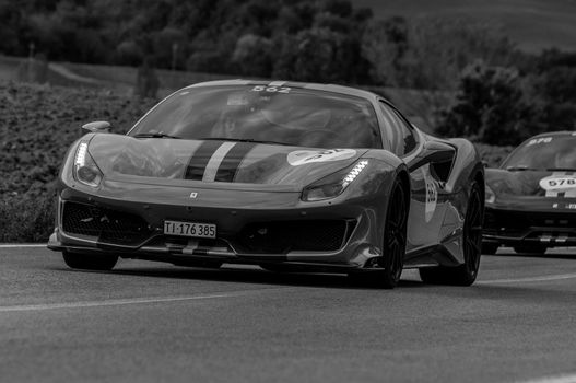 CAGLI , ITALY - OTT 24 - 2020 : FERRARI 488 PISTA on an old racing car in rally Mille Miglia 2020 the famous italian historical race (1927-1957)