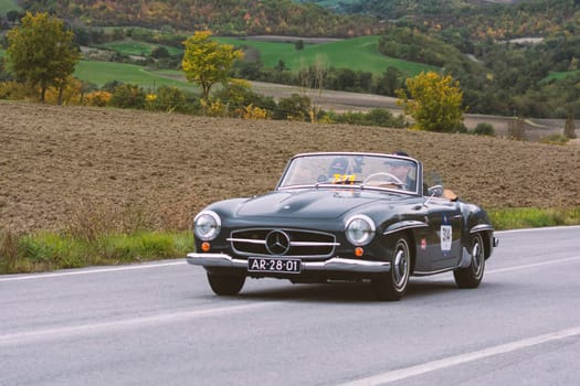 CAGLI , ITALY - OTT 24 - 2020 : MERCEDES-BENZ 190 SL 1955 on an old racing car in rally Mille Miglia 2020 the famous italian historical race (1927-1957