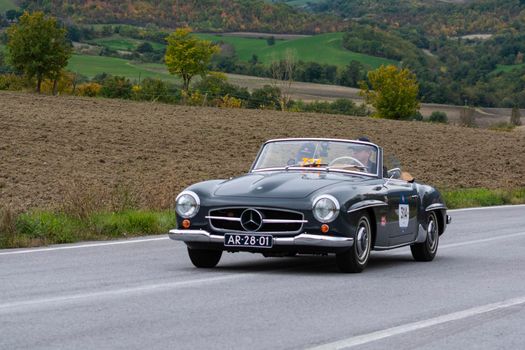 CAGLI , ITALY - OTT 24 - 2020 : MERCEDES-BENZ 190 SL 1955 on an old racing car in rally Mille Miglia 2020 the famous italian historical race (1927-1957