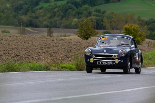 CAGLI , ITALY - OTT 24 - 2020 : SIMCA 9 ARONDE COUPÉ 1952 on an old racing car in rally Mille Miglia 2020 the famous italian historical race (1927-1957)