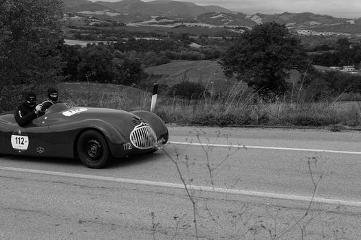 CAGLI , ITALY - OTT 24 - 2020 : FIAT-LANCIA APRILIA BARCHETTA FAINA 1939 on an old racing car in rally Mille Miglia 2020 the famous italian historical race (1927-1957