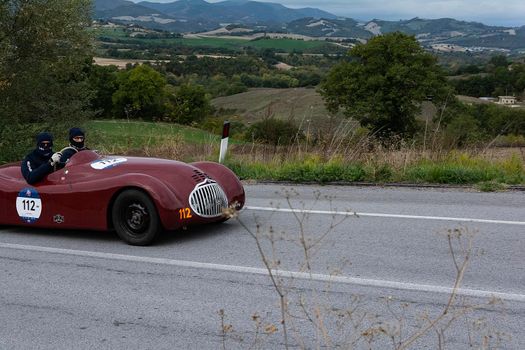 CAGLI , ITALY - OTT 24 - 2020 : FIAT-LANCIA APRILIA BARCHETTA FAINA 1939 on an old racing car in rally Mille Miglia 2020 the famous italian historical race (1927-1957