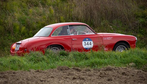 CAGLI , ITALY - OTT 24 - 2020 : ALFA ROMEO 1900 C SUPER SPRINT TOURING 1955 on an old racing car in rally Mille Miglia 2020 the famous italian historical race (1927-1957)