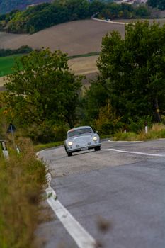 CAGLI , ITALY - OTT 24 - 2020 : PORSCHE 356 1500 SUPER COUPÉ 1953 on an old racing car in rally Mille Miglia 2020 the famous italian historical race (1927-1957)