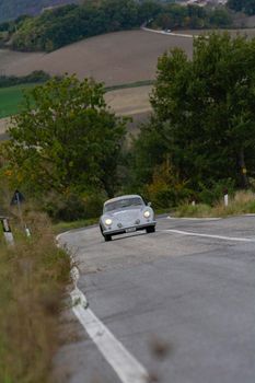 CAGLI , ITALY - OTT 24 - 2020 : PORSCHE 356 1500 SUPER COUPÉ 1953 on an old racing car in rally Mille Miglia 2020 the famous italian historical race (1927-1957)